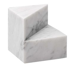 a white marble block sitting on top of each other