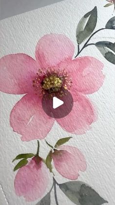 a pink flower painted on white paper with green leaves and red flowers in the center