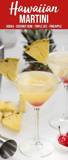 two martinis with pineapple garnish on the rim