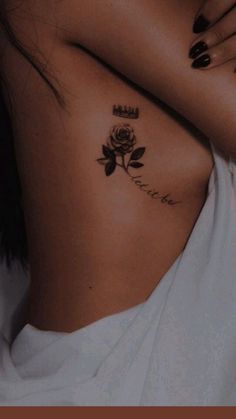 a woman with a rose tattoo on her chest