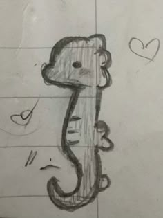 a drawing of a seahorse on paper with hearts in the backgroung