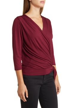 Cut from a soft, drapey jersey knit with an easy faux-wrap design, this top is an ideal choice for both casual looks or more styled up outfits. 23" length Surplice V-neck Three-quarter sleeves 95% rayon, 5% spandex Machine wash, dry flat Imported Tie Wrap Top, Purple Wrap, Tie Wrap, Wrap Top, Three Quarter Sleeves, Three Quarter, Knit Jersey, Casual Looks, Top Brands