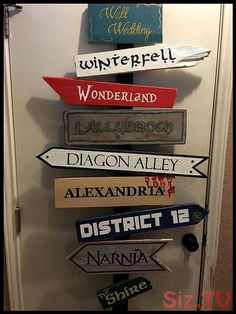 a bunch of signs that are on the side of a door