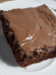 a piece of chocolate cake on a white plate