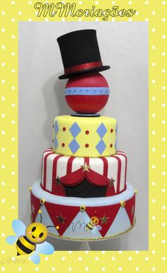 a three tiered cake with a top hat on it's head and a bee