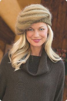 a woman wearing a knitted hat and sweater