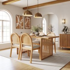 a dining room table with four chairs next to an open door and large windows in the background