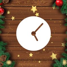 a clock surrounded by christmas decorations on a wooden background with stars and snowflakes