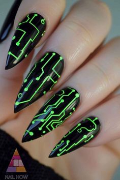 Sleek black nails with neon green circuit designs. Ideal for tech enthusiasts looking to flaunt their passion in style. Head to nailhow.com for more unique black acrylic nail ideas. Don’t forget to save this pin! Nail Designs Glow In The Dark, Blue Green And Black Nails, Birthday Neon Nails, Green And Black Nails Ideas, Black With Green Nails, Black Nails With Neon Green, Circuit Board Nails, Cyberpunk Nails Black, Neon Black Nails