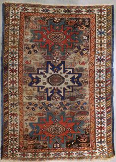 an old rug with many different colors and patterns