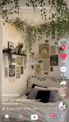 the bedroom is decorated in white and has plants growing on the wall above the bed