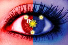 a woman's eye with the flag of philippines painted on it and stars in the center