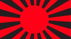 a red and black sunburst is in the middle of a circle on a black background