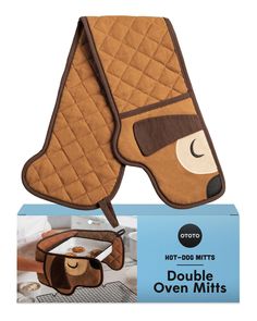 the oven mitt is shaped like a dog's head and has a brown cover over it