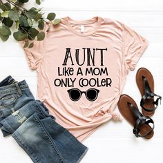 "Cute Auntie T-Shirt, Best Aunt Shirt, Gift For Aunt, Cool Auntie Gift, Auntie Birthday Shirt, Auntie T-Shirt, Gift Idea For Auntie, New Aunt ----- How To Order ----- 1-) Please, check and review all the photos. 2-) Choose your t-shirt size and color. *Different styles of shirts may have different shades of same color choice due to different manufacturer brands. *For this reason, we recommend you to match shirts from the same styles if you want precisely matching colors (ex. Unisex, V-necks, Tod New Aunt, Like A Mom, Matching Colors, Aunt Gifts