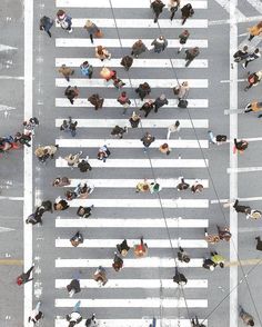 an overhead view of people crossing the street