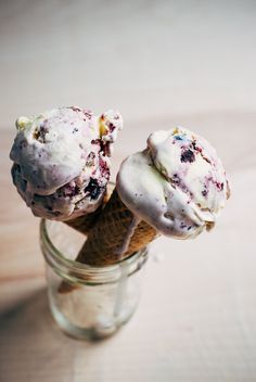 two ice cream cones in a glass jar