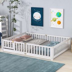 a baby's room with a crib, dresser and bed