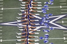 the cheerleaders are lined up on the field