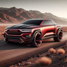 a red and black truck driving down a desert road with mountains in the back ground