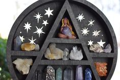 a shelf filled with different types of crystals