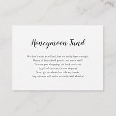 a white business card with the words honeymoon fund written in cursive writing on it