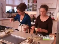 two women in the kitchen preparing food together