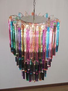 a multicolored chandelier hanging from a ceiling