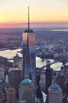 an aerial view of the skyscrapers in new york city, ny at sunset or dawn