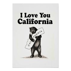 a black bear holding a sign that says i love you california with the caption california