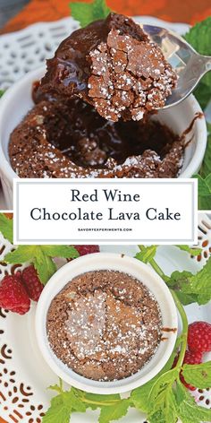 red wine chocolate lava cake on a white plate with raspberries and green leaves