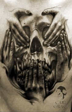 a black and white photo of hands covering a skull with it's face in the middle