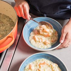 two bowls filled with soup on top of a stove