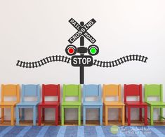 there is a stop sign and railroad track wall decal