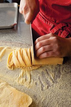 a person cutting some food with a knife