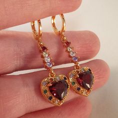 Colorful Gemstone Jewelry, Ruby Gold Jewellery, Valentine's Day Heart Gemstone Earrings, Elegant Red Heart-shaped Earrings, Valentine's Day Cubic Zirconia Dangle Heart Earrings, Valentine's Day Cubic Zirconia Heart Dangle Earrings, Red Heart-shaped Cubic Zirconia Earrings, Valentine's Day Fine Jewelry Heart Dangle Earrings, Red Dangle Heart Earrings For Anniversary