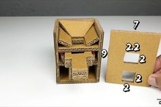 an open cardboard box with instructions on how to make a doll house out of it