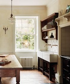 the kitchen is clean and ready to be used for cooking or baking, while also being used as a dining room