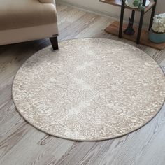 a living room with a chair and rug on the floor