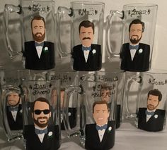 six glasses with the faces of two men in tuxedos