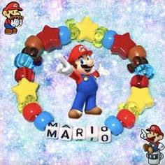 the mario bracelet is on display in front of a blue background with stars and letters