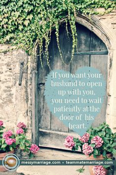 a wooden door with pink flowers in front of it and a quote on the side