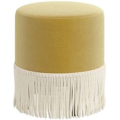 a yellow and white ottoman with fringe trim