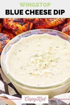 a glass bowl filled with cheese dip next to chicken wings on the side and text overlay that reads, wingstop blue cheese dip