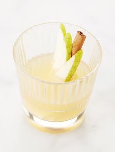 a glass bowl filled with liquid and apple slices