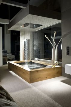 a bathroom with a large bathtub next to a window