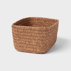 a large woven basket is shown on a white background, it's made out of straw