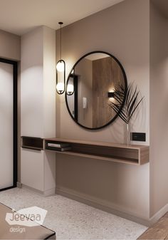 a round mirror hanging on the wall above a wooden table with a plant in it