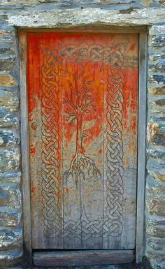 an old wooden door with intricate designs on it