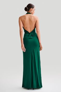 For the perfect guestThe ELYNA Slinky Halter Maxi Dress is the epitome of elegance and allure. Its halter neckline and ruched centre front exude sophistication, while the low back adds a touch of sultry charm. With ruched centre back detail, this dress offers a flattering silhouette from every angle. Designed to hug your curves, its bodycon fit accentuates your figure effortlessly. Perfect for any special occasion, the maxi length adds drama and elegance to your ensemble. Embrace timeless style Green Gown Aesthetic, Green Gown Elegant, Green Maxi Dress Wedding, Dark Green Dress Formal, Backless Green Dress, Dark Green Dresses, Wedding Guest Dresses Elegant, Green Wedding Guest Dress, Gown Aesthetic